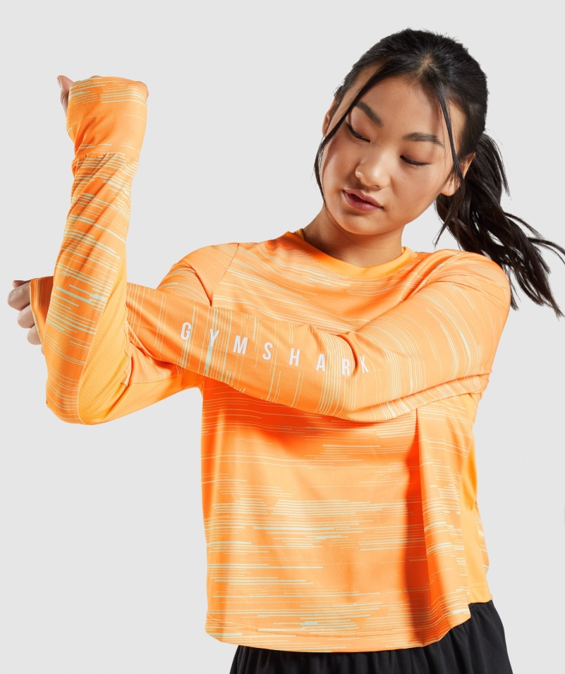 Gymshark športové Voľné Tričko S Dlhým Rukávom S Oranžovou Potlačou