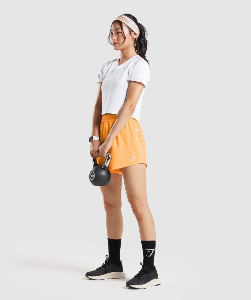 Gymshark športové Voľné šortky Marhuľová Oranžová