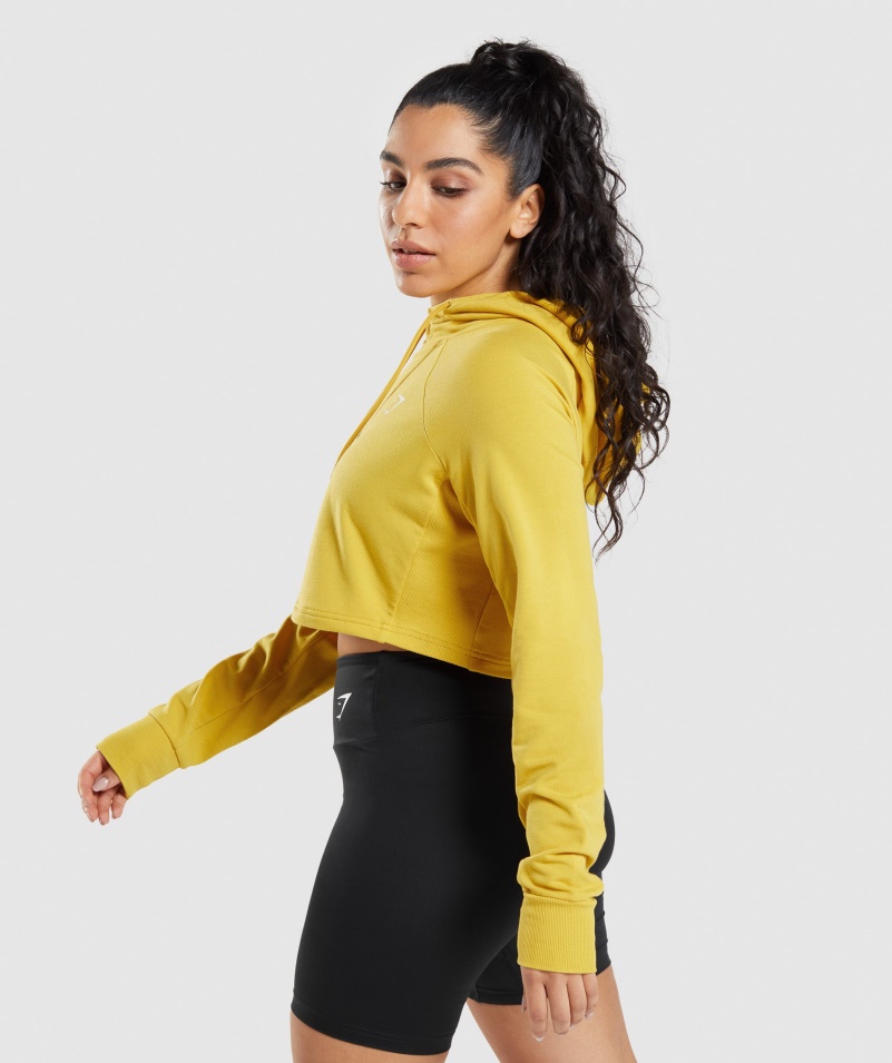 Gymshark Training Cropped Mikina S Kapucňou Medailón žltý